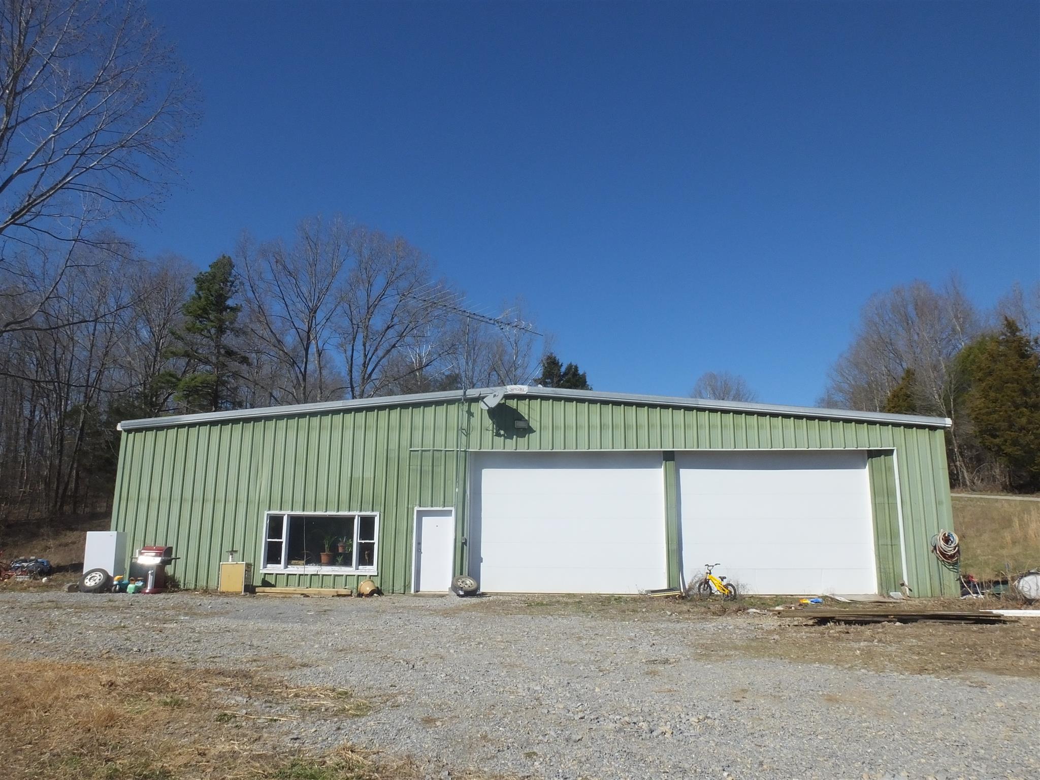 9575 Goose Branch Road Bon Aqua, TN 37025 - Photo 23 of 28 40' X 60" commercial metal building has two 12' X 16' doors, 3-phase industrial electric service and a 900 sq. ft., 2 BR, 2 BA apartment.