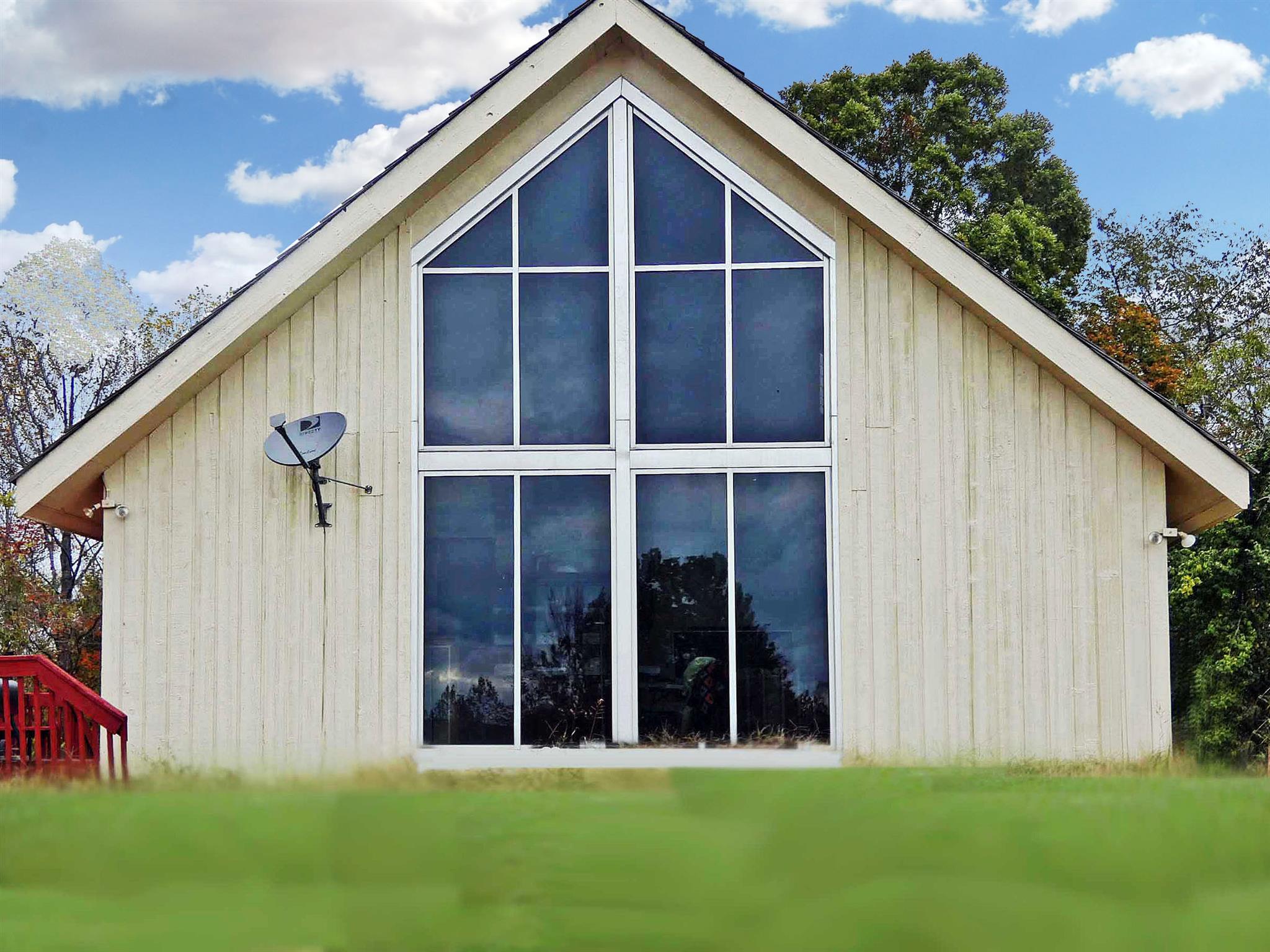 9575 Goose Branch Road Bon Aqua, TN 37025 - Photo 4 of 28 Floor-to-ceiling windows give a panoramic view of the surrounding pasture and hills.