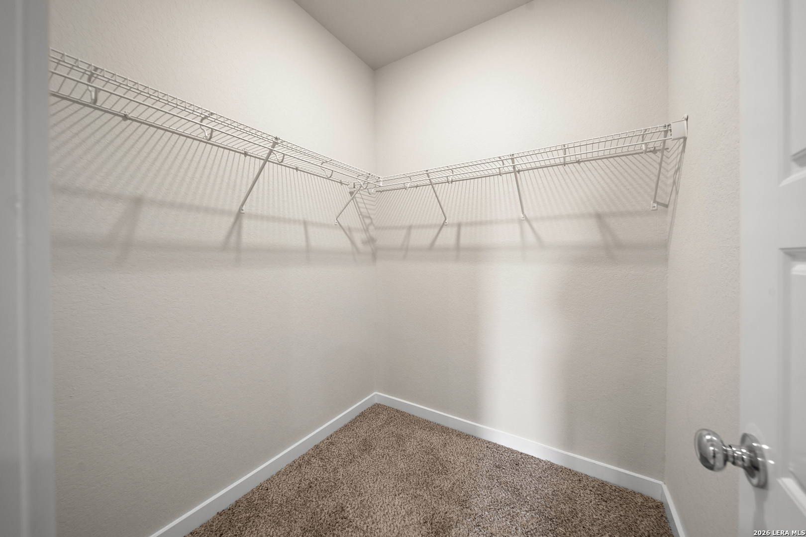 6914 Cetera Way Converse, TX 78109 - Photo 6 of 32 a view of a room with racks on the wall