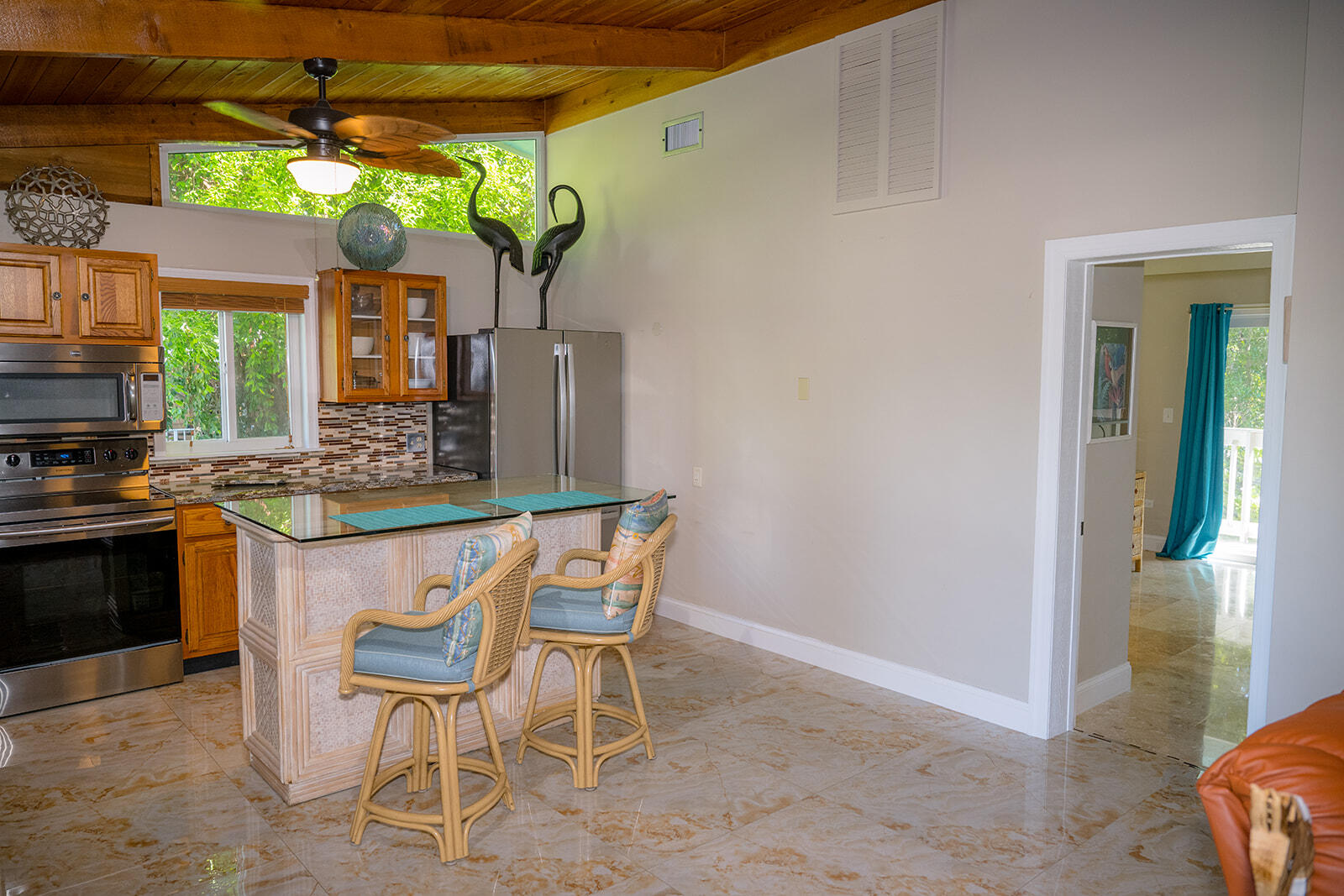 21 Sunset Road Key Largo, FL 33037 - Photo 18 of 121 a kitchen with a sink cabinets and stove top oven