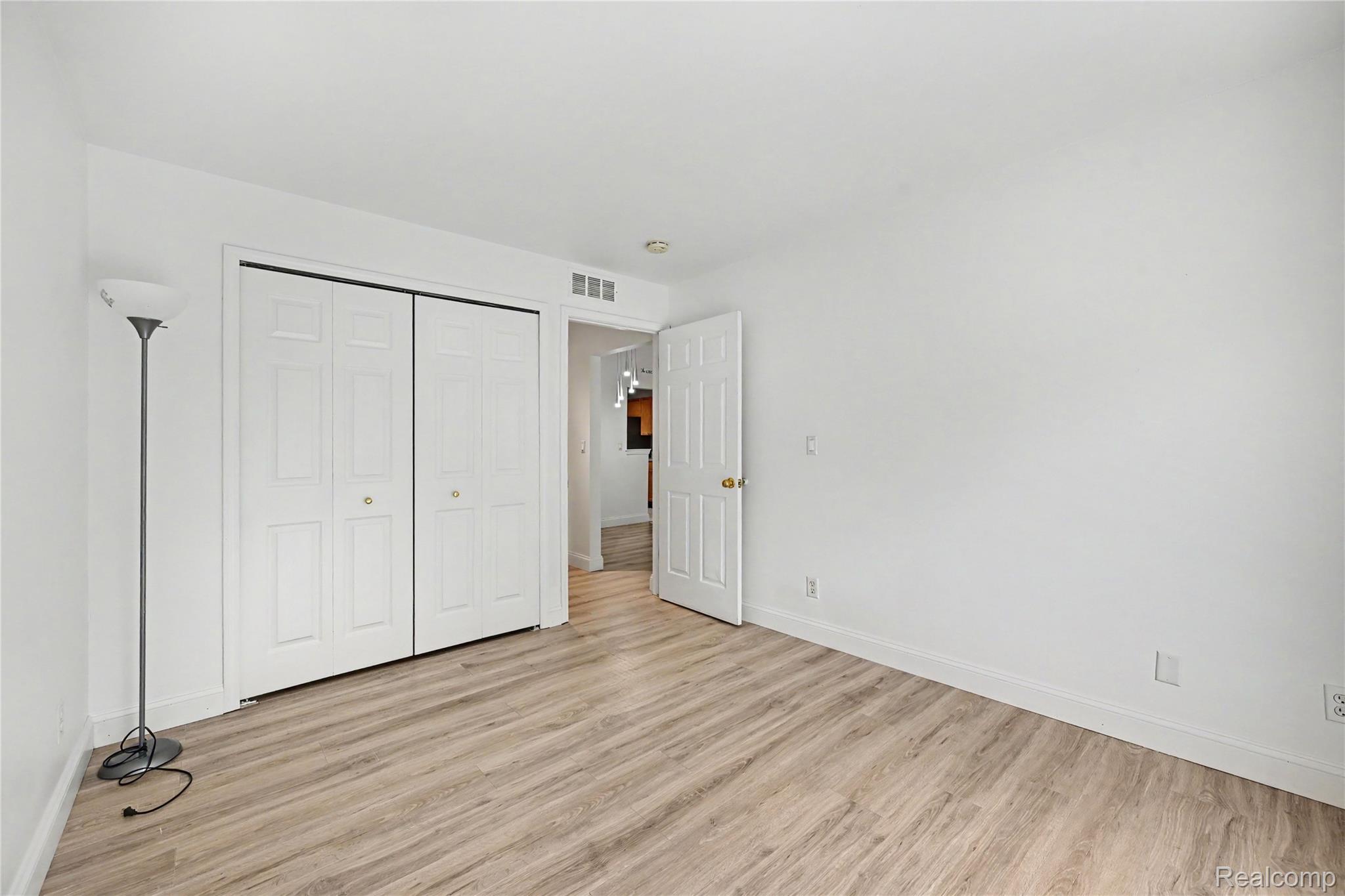3633 Oakmonte Boulevard, Unit 189 Rochester, MI 48306 - Photo 26 of 36 Interior room featuring wood-finish flooring and white baseboards