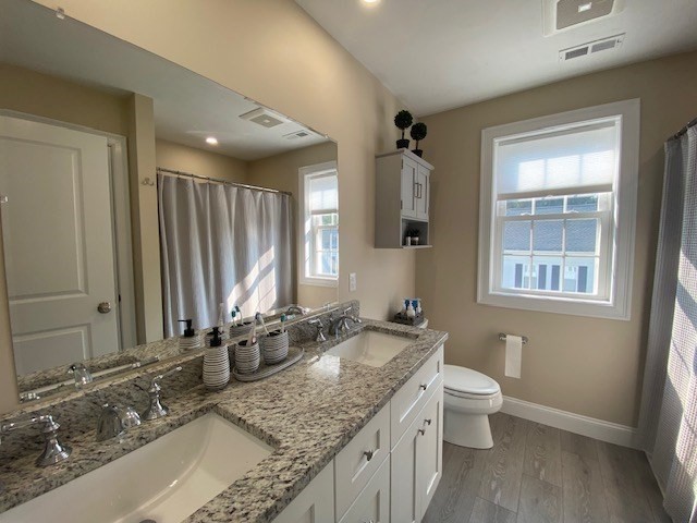 152 West Main Street, Unit A Millbury, MA 01527 - Photo 18 of 33 a bathroom with a granite countertop sink and a mirror