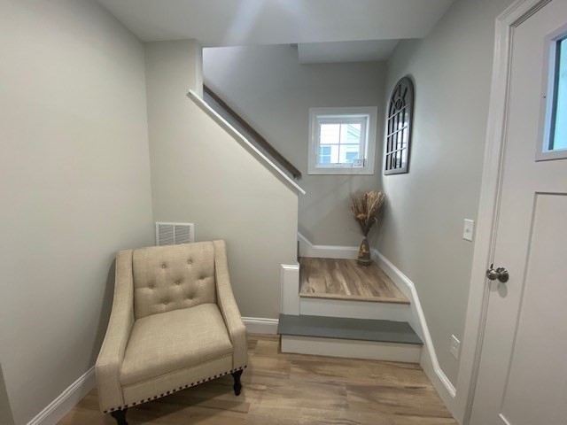 152 West Main Street, Unit A Millbury, MA 01527 - Photo 2 of 33 a living room with furniture and a wooden floor