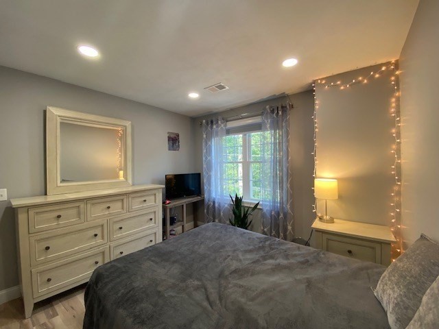152 West Main Street, Unit A Millbury, MA 01527 - Photo 26 of 33 a bedroom with a bed and a dresser