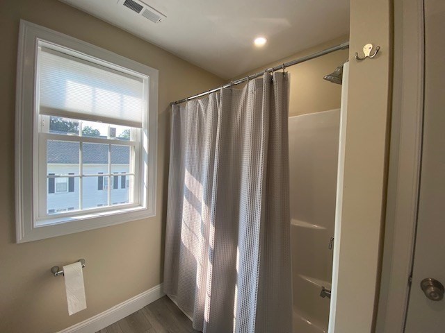 152 West Main Street, Unit A Millbury, MA 01527 - Photo 28 of 33 a bathroom with a glass door shower and a sink