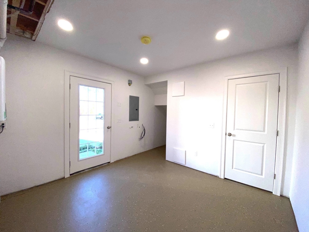 152 West Main Street, Unit A Millbury, MA 01527 - Photo 33 of 33 an empty room with windows and closet
