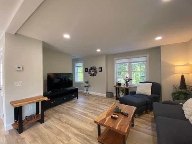 152 West Main Street, Unit A Millbury, MA 01527 - Photo 5 of 33 a living room with furniture and a flat screen tv