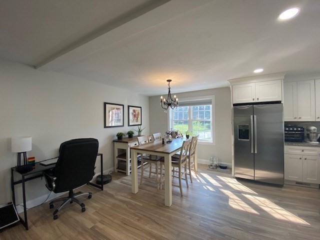 152 West Main Street, Unit A Millbury, MA 01527 - Photo 10 of 33 a view of a dining room with furniture window and wooden floor