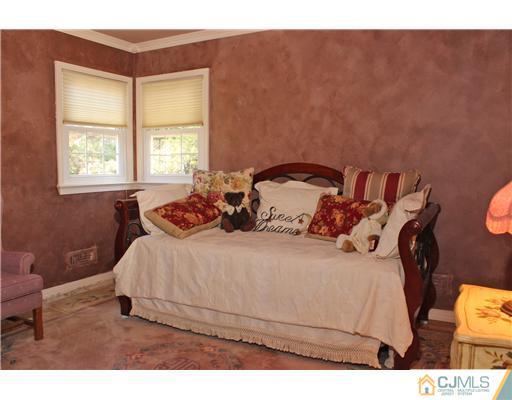 10 Moraine Road Edison, NJ 08820 - Photo 22 of 25 a bedroom with a bed and a window