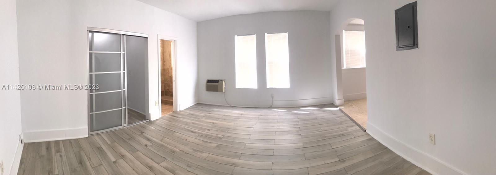 Flamingo-Lummus Miami Beach, FL 33139 - Photo 5 of 13 a view of empty room with wooden floor and fan