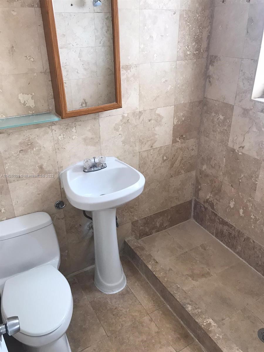 Flamingo-Lummus Miami Beach, FL 33139 - Photo 7 of 13 a bathroom with a sink toilet and mirror