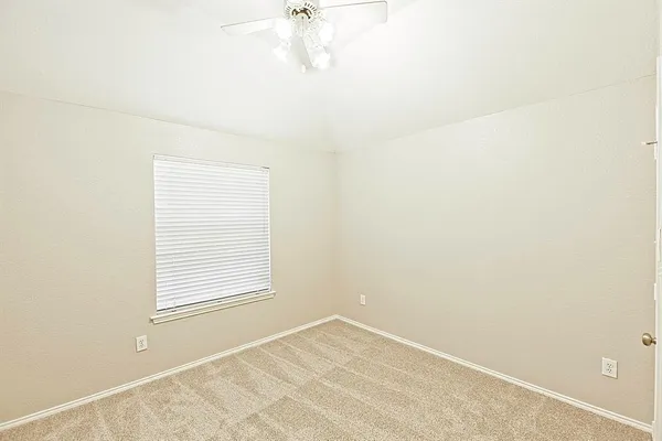an empty room with closet area