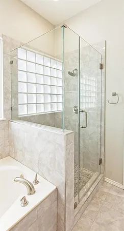 a bathroom with a bathtub and a shower