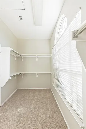 a view of an empty walk in closet