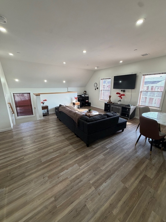 20 Graham Street, Unit 4 Gardner, MA 01440 - Photo 11 of 23 a living room with furniture and a wooden floor