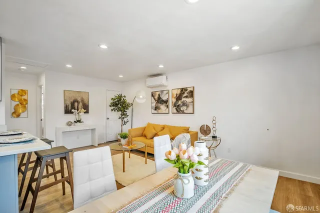 a living room with furniture and flowers