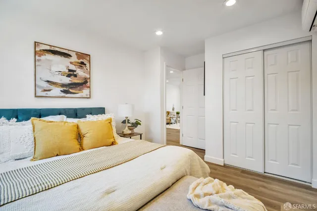 a bedroom with a bed and a couch