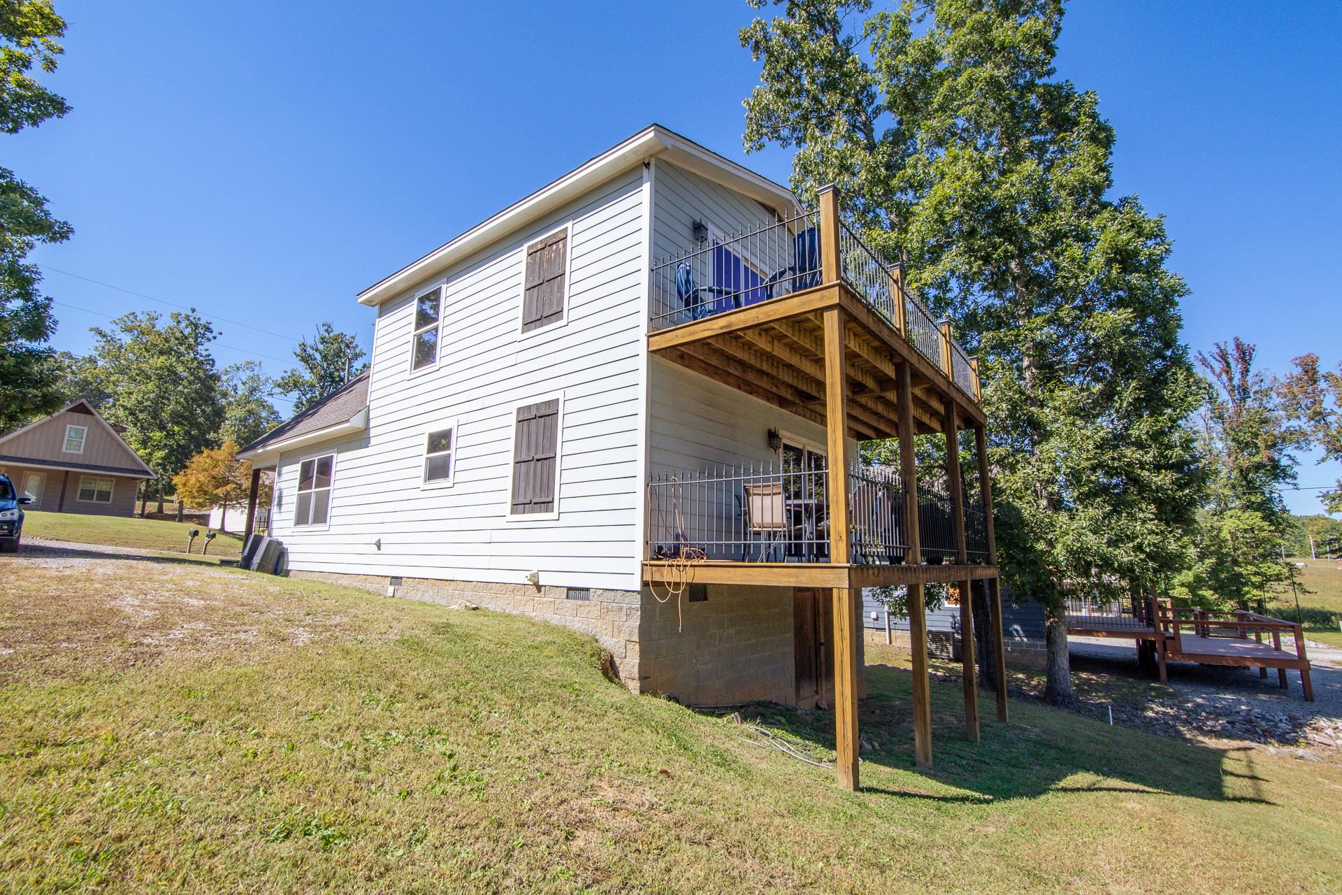 25 Bogey Loop Counce, TN 38326 - Photo 4 of 37 Rear view of property with a lawn, crawl space, a balcony, and a wooden deck