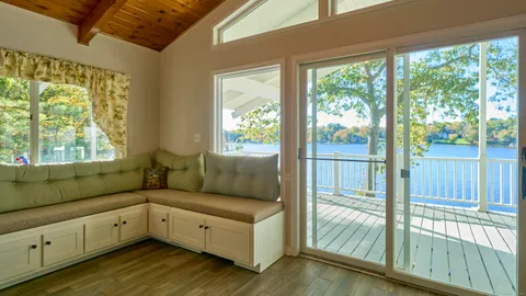 a kitchen with a refrigerator window and cabinets