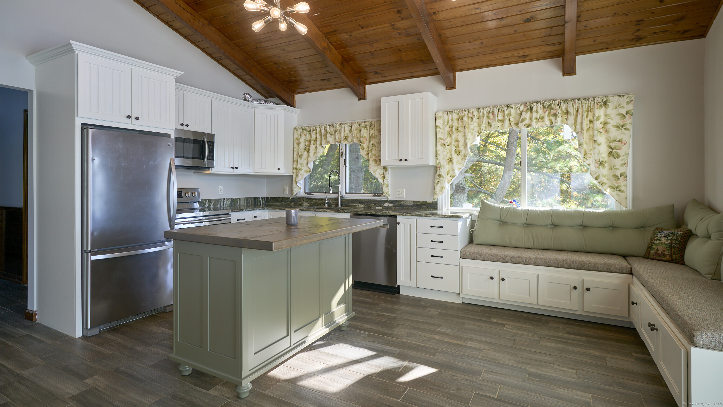 42 Dogwood Road East Haddam, CT 06469 - Photo 21 of 40 a kitchen with a refrigerator window and cabinets