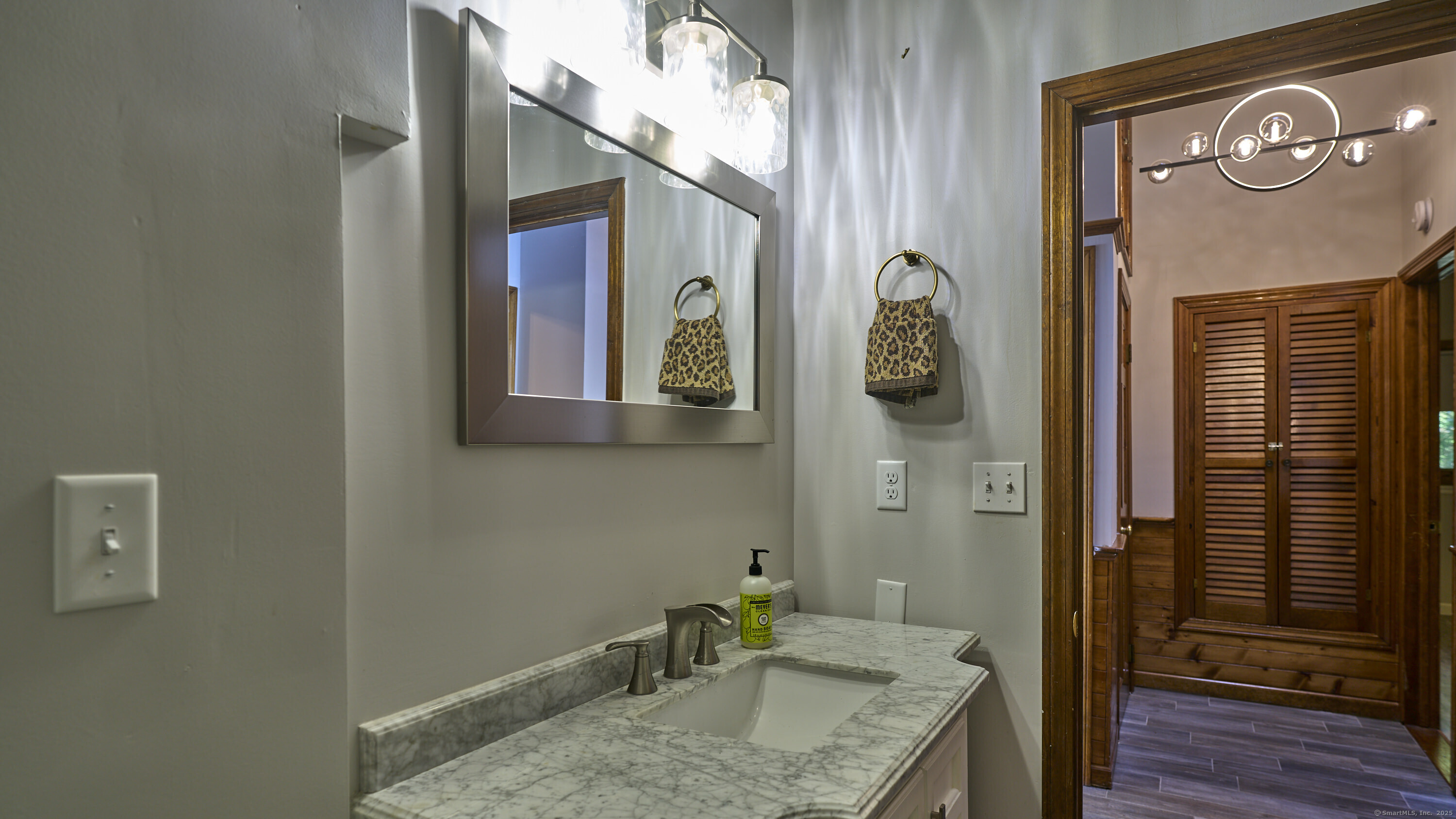 42 Dogwood Road East Haddam, CT 06469 - Photo 25 of 40 a bathroom with a granite countertop sink and a mirror