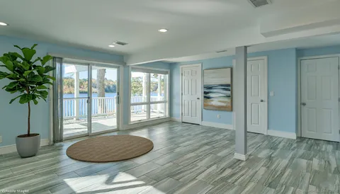 a bathroom with a shower a toilet and a sink