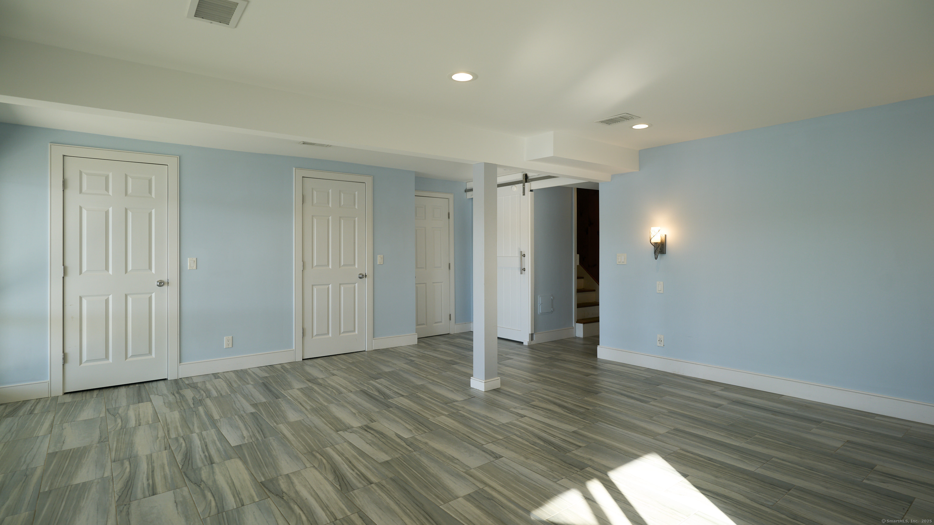 42 Dogwood Road East Haddam, CT 06469 - Photo 40 of 40 a view of an empty room with wooden floor