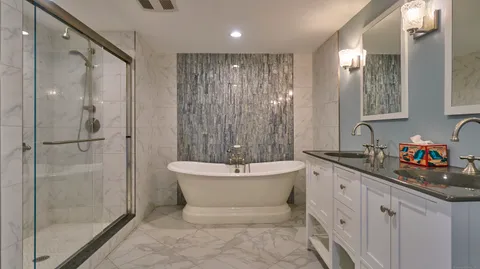 a white bath tub sitting in a bathroom