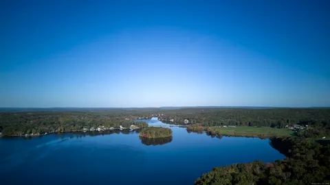 a front view of a house with a yard and pathway