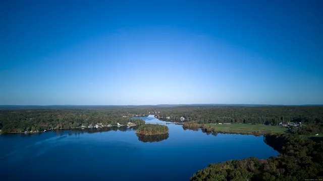 a front view of a house with a yard and pathway
