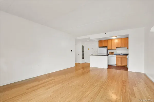 a view of a kitchen with wooden floor