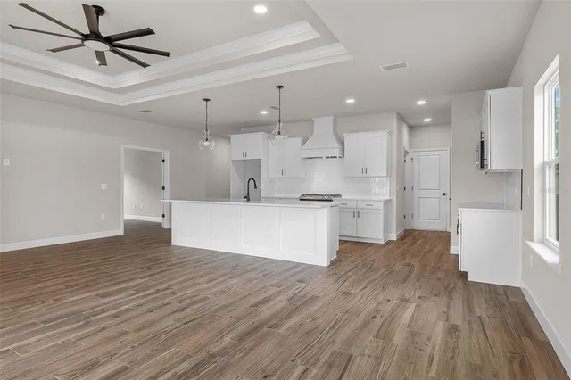 a view of kitchen with wooden floor and window