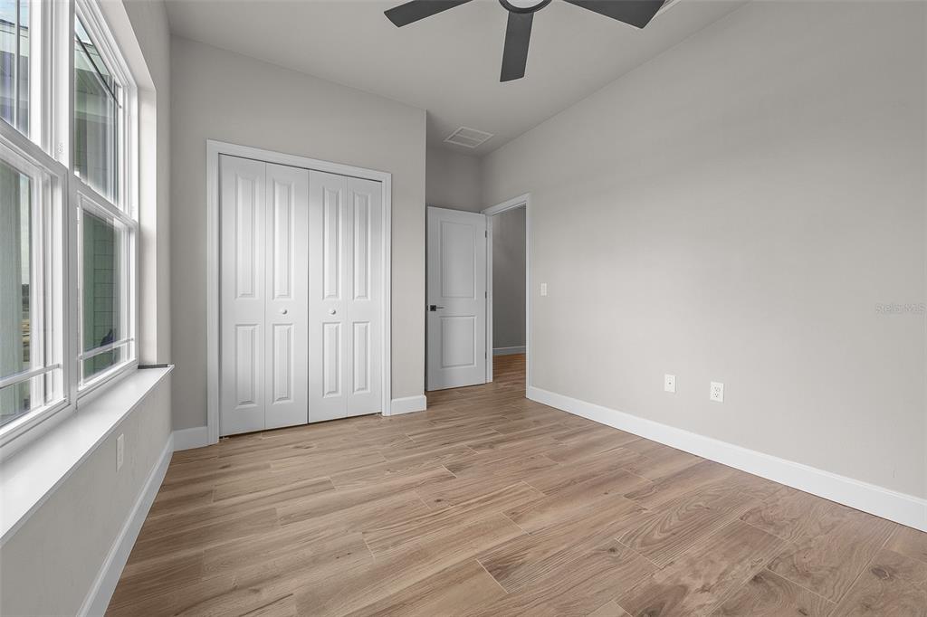 6694 Southwest 11th Lane Gainesville, FL 32607 - Photo 7 of 27 a view of an empty room with a window