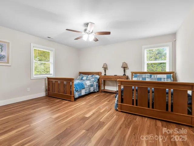 a bed room with a bed and a window