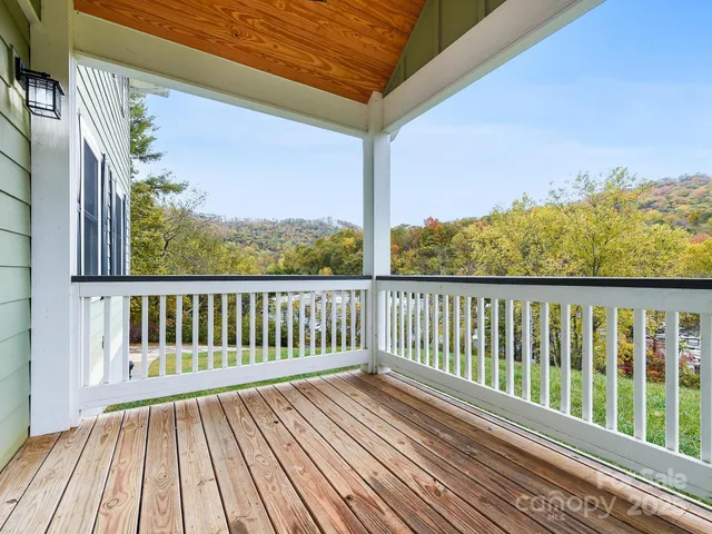 a view of balcony with wooden floor