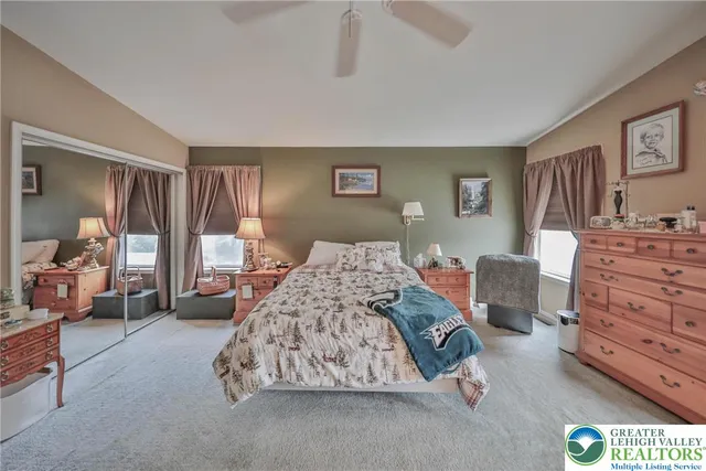 a bedroom with a bed and with furniture