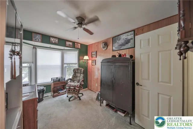 a view of a livingroom with furniture and a window