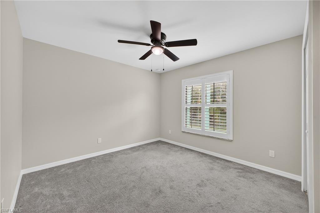 8422 Cardinal Road Fort Myers, FL 33967 - Photo 15 of 24 Carpeted empty room with baseboards and a ceiling fan