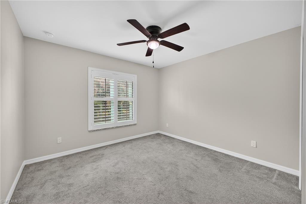 8422 Cardinal Road Fort Myers, FL 33967 - Photo 17 of 24 Unfurnished room featuring light carpet and ceiling fan