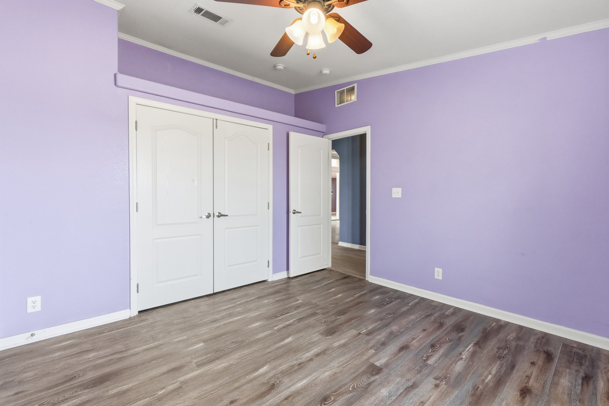 1951 Dowdy Road Seguin, TX 78155 - Photo 10 of 40 Rich wood-look flooring and crown molding define this versatile secondary space.