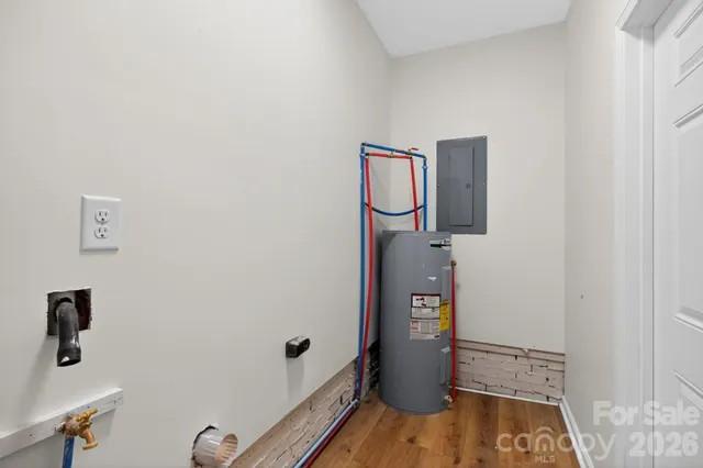 a view of hallway with wooden floor