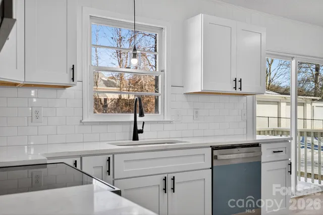 a kitchen with a sink and cabinets