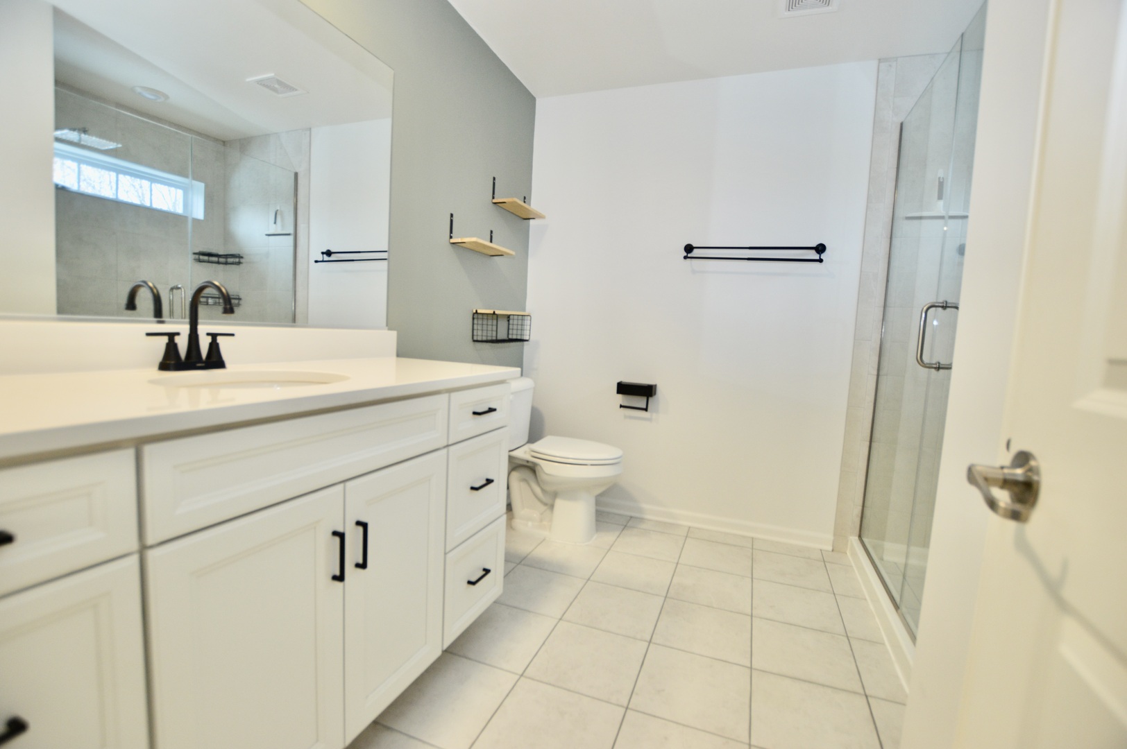 1029 Draper Road McHenry, IL 60050 - Photo 18 of 30 a bathroom with a sink a toilet and shower