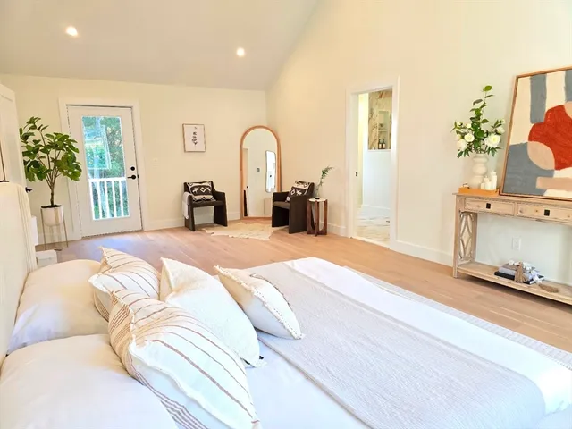 a view of a livingroom with furniture and a workspace