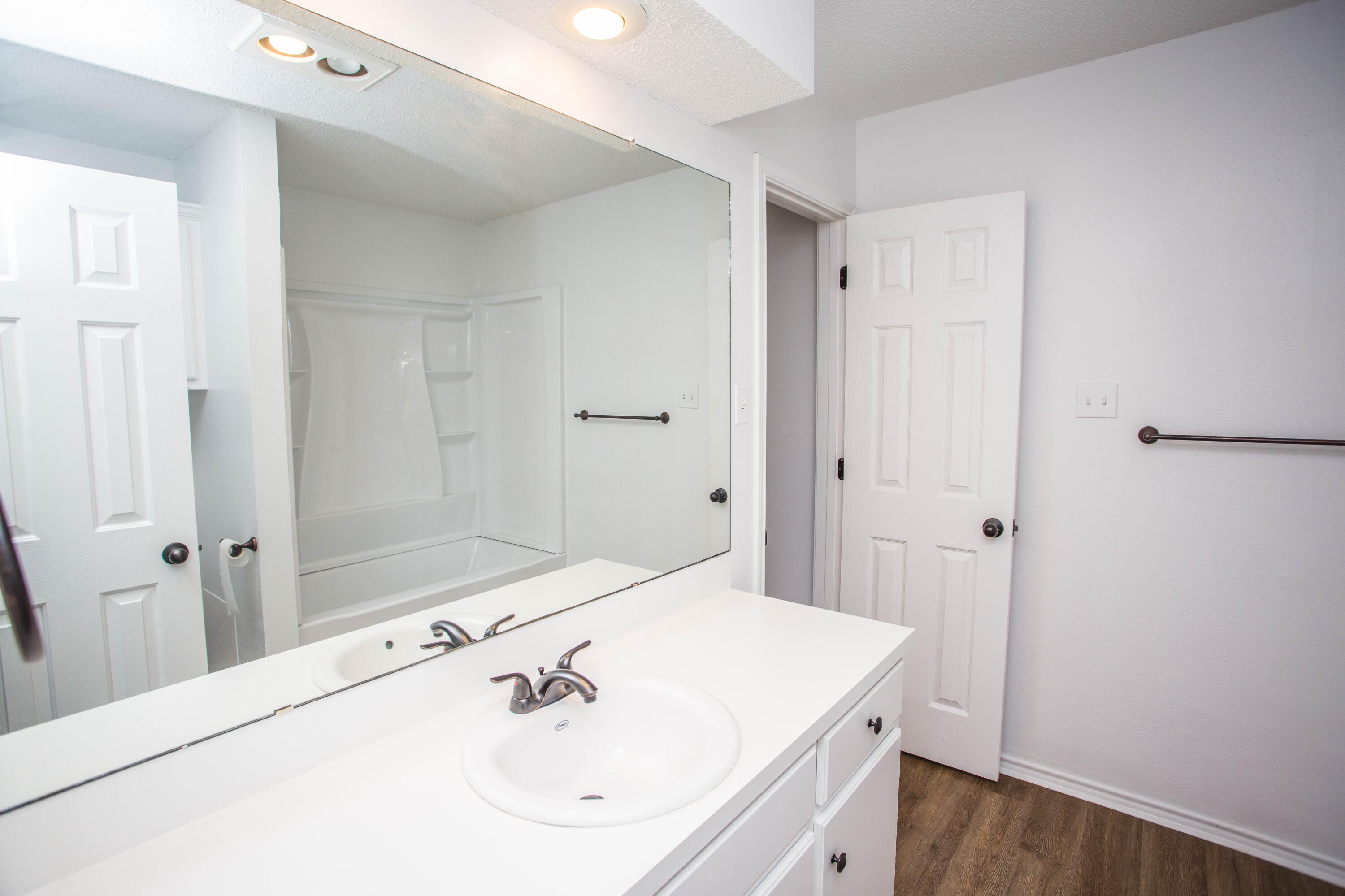 1822 79th Street Lubbock, TX 79423 - Photo 21 of 35 a bathroom with a sink and a mirror