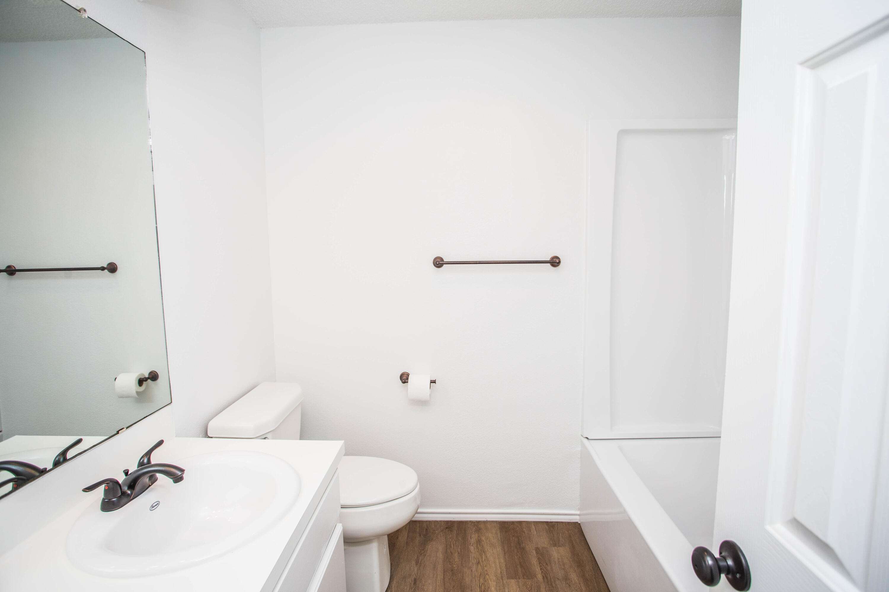 1822 79th Street Lubbock, TX 79423 - Photo 28 of 35 a bathroom with a sink and a toilet