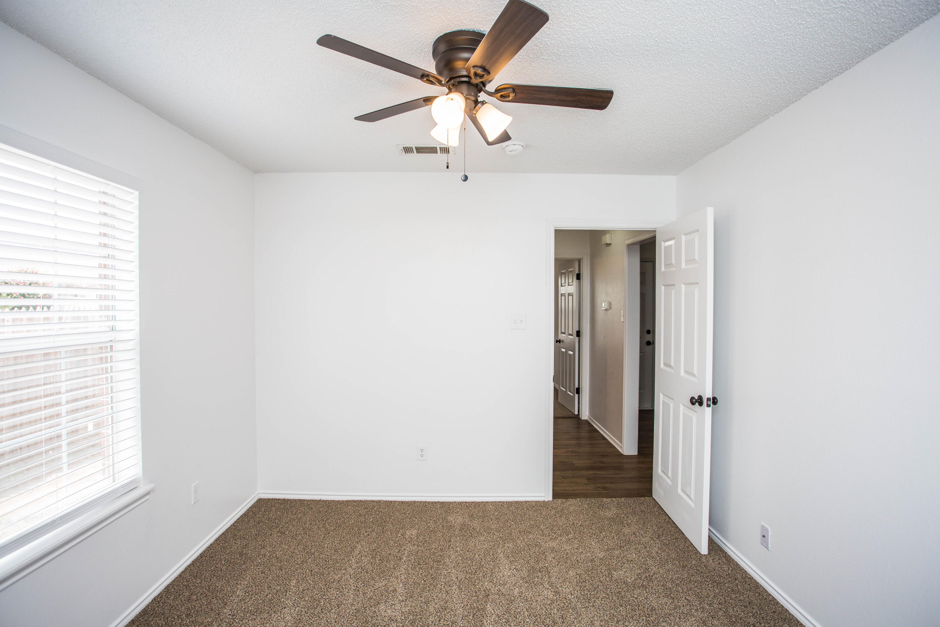 1822 79th Street Lubbock, TX 79423 - Photo 29 of 35 a view of an empty room with a window