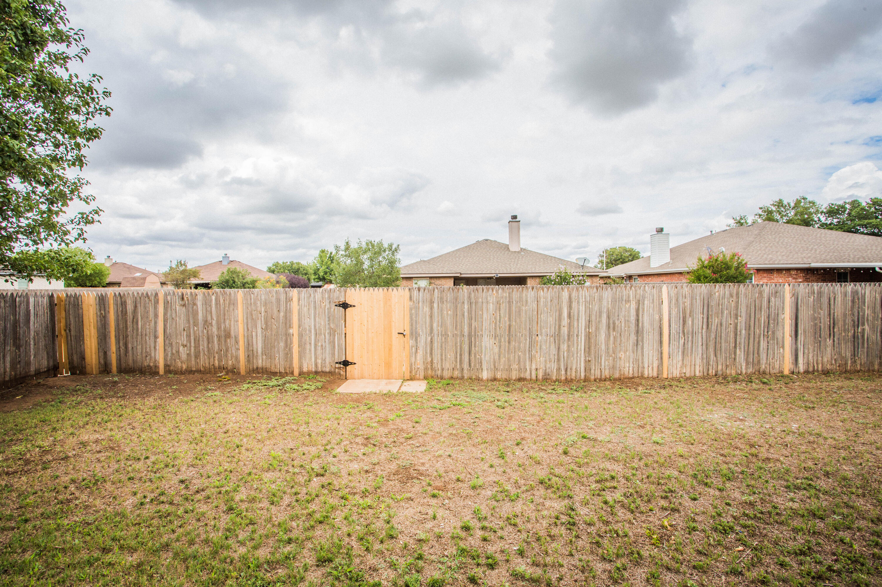1822 79th Street Lubbock, TX 79423 - Photo 34 of 35 a view of a backyard