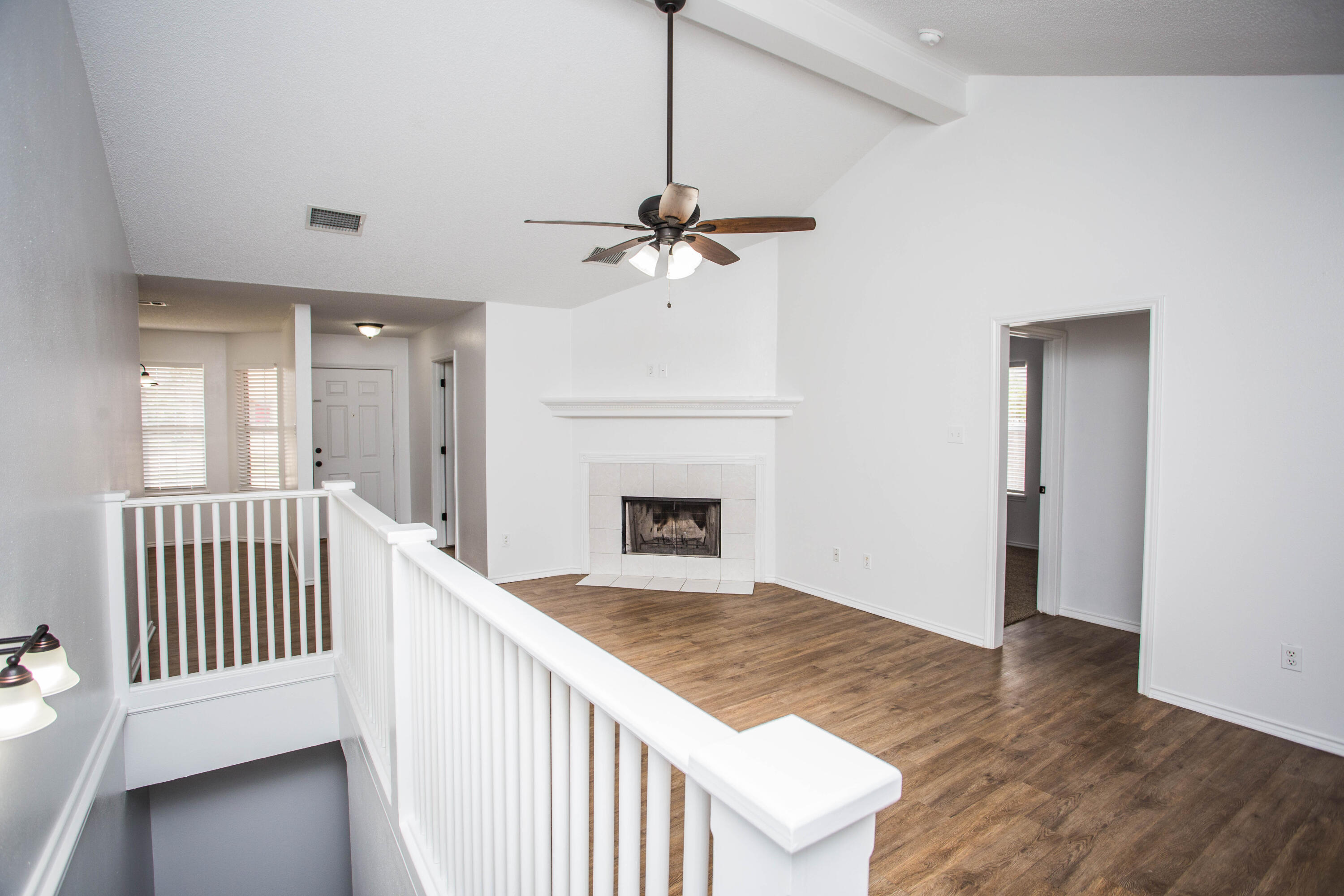 1822 79th Street Lubbock, TX 79423 - Photo 7 of 35 a view of a livingroom with a fireplace and wooden floor
