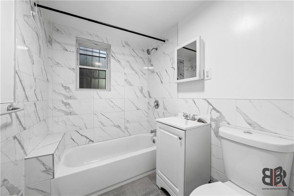 284 MacDougal Street Brooklyn, NY 11233 - Photo 12 of 23 a bathroom with a sink toilet and shower